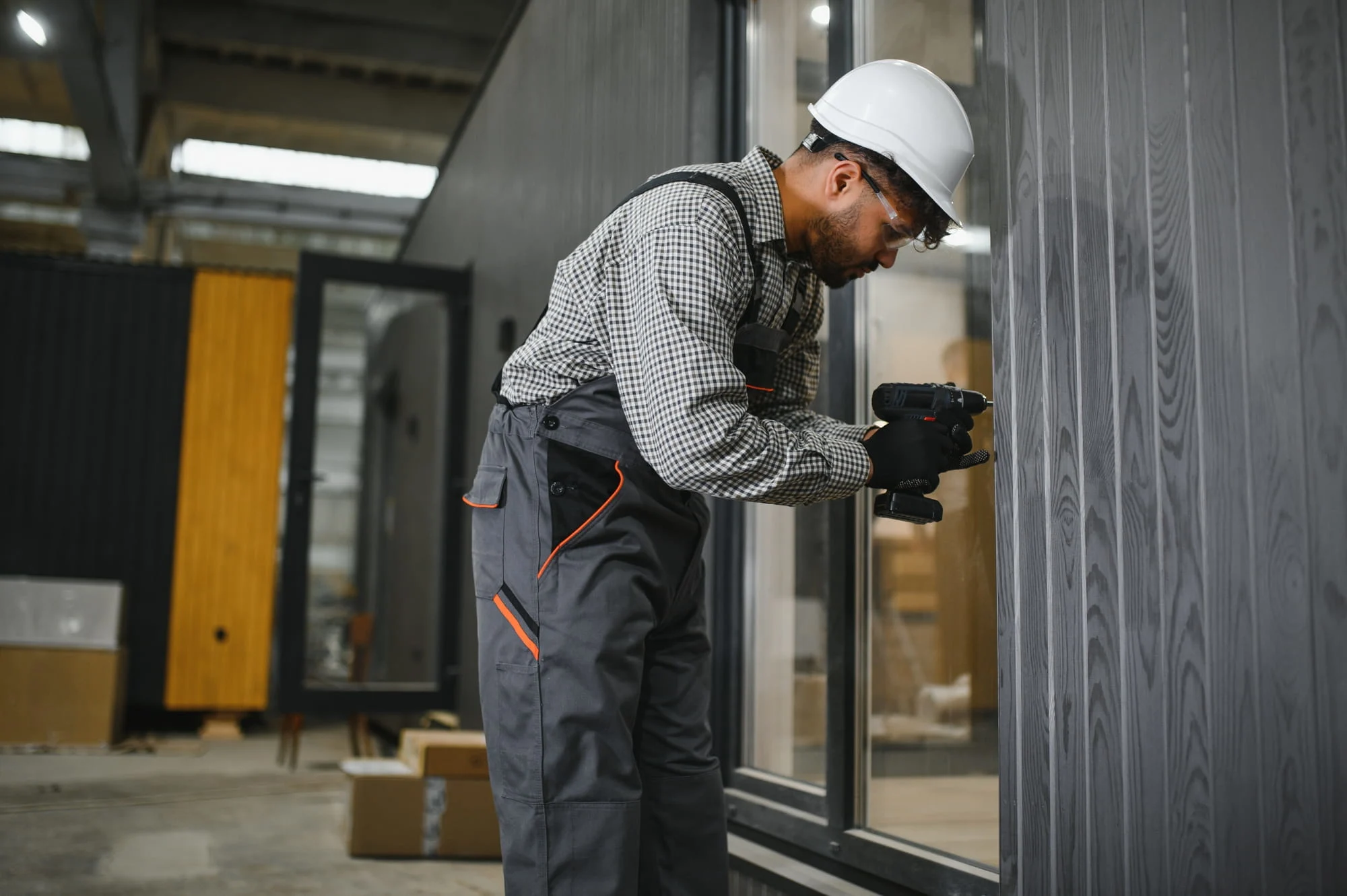 Fitting lock and latch hardware to the edge of a commercial door leaf